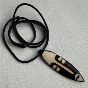 African Bone Face Mask Pendant Necklace on adjustable cord